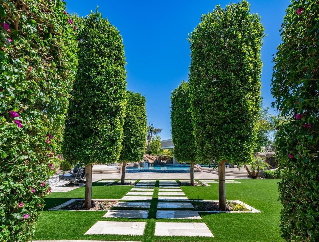 path paving stones surrounded by artificial grass in a property in Tucson AZ